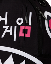 Load image into Gallery viewer, Sprayground Squid Game Logo Shark Mouth DLXR BACKPACK - Clique Apparel